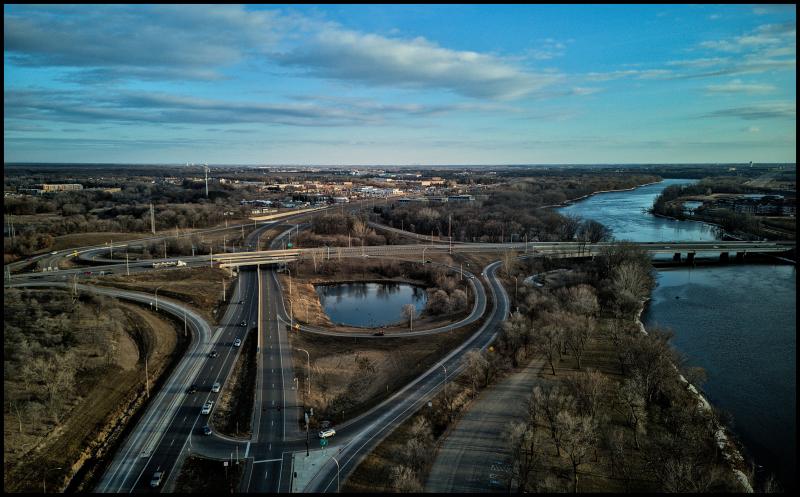 Aerial view of a highway interchange alongside of the Mississippi river.